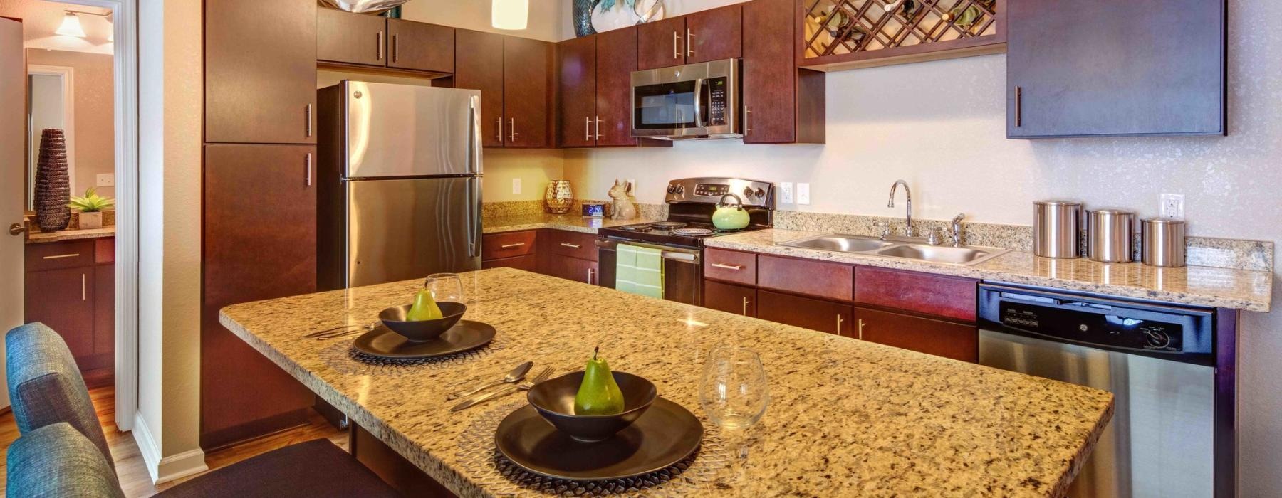a kitchen with a marble island
