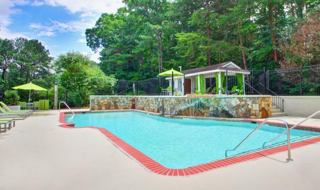 a swimming pool with a building in the background