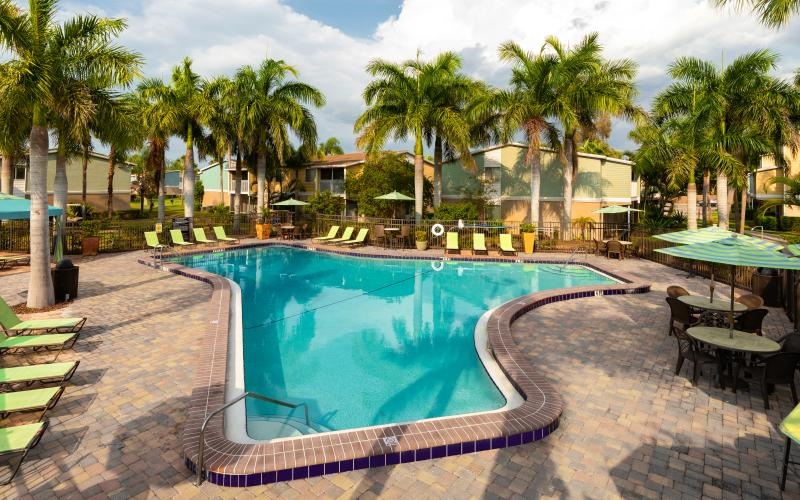 a pool with chairs around it