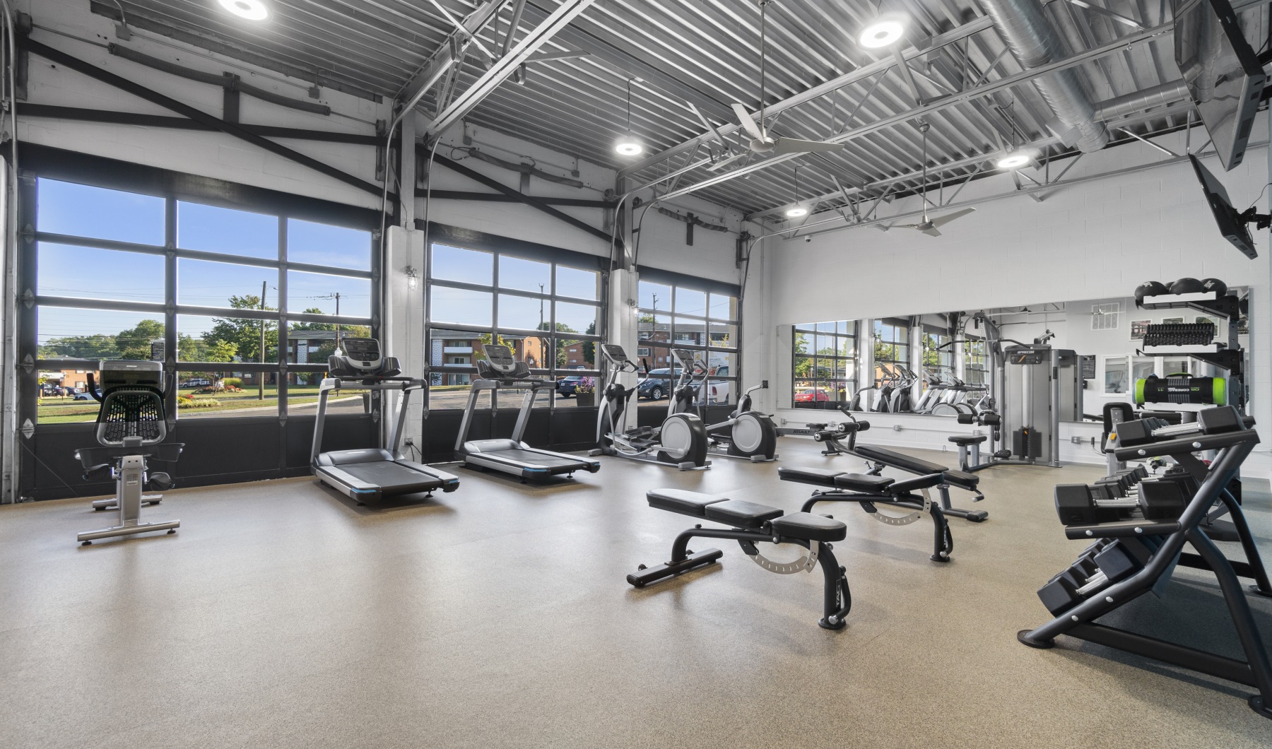 Fitness center with bright bay doors