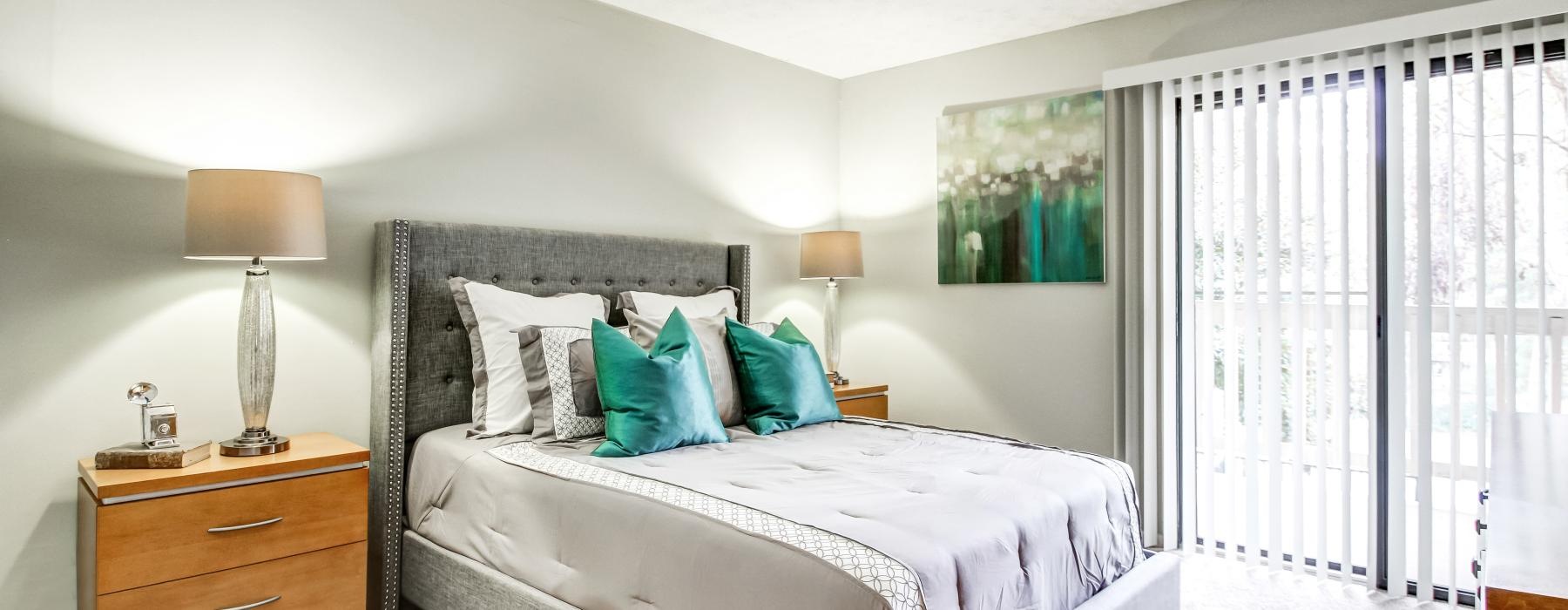 a bed with a white bed spread