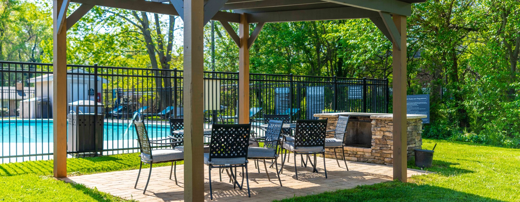 Resident grilling area and gazebo next to the pool