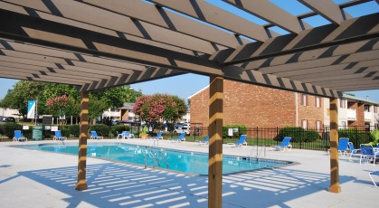 Large wooden pergola overlooking the swimming pool
