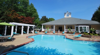 Swimming pool with pergola and lounge chairs
