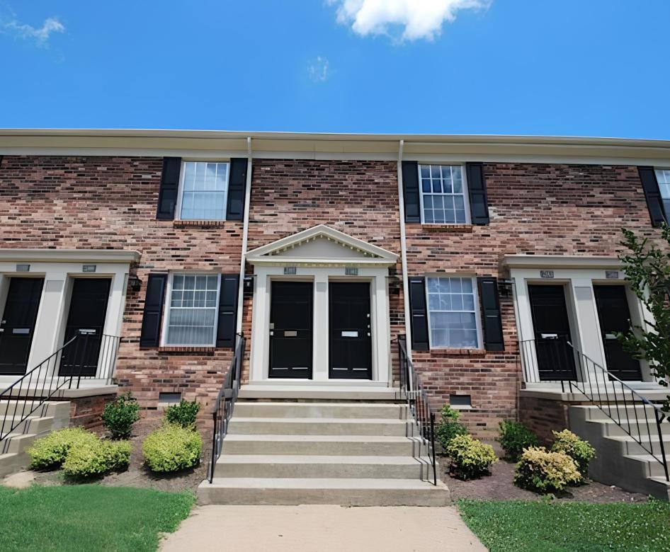 a brick building with a front entrance