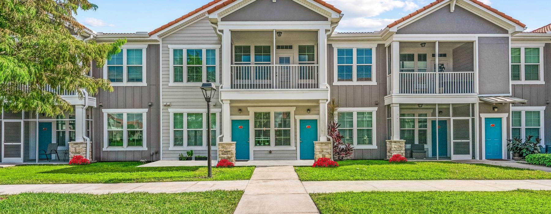 a large building with a lawn in front of it