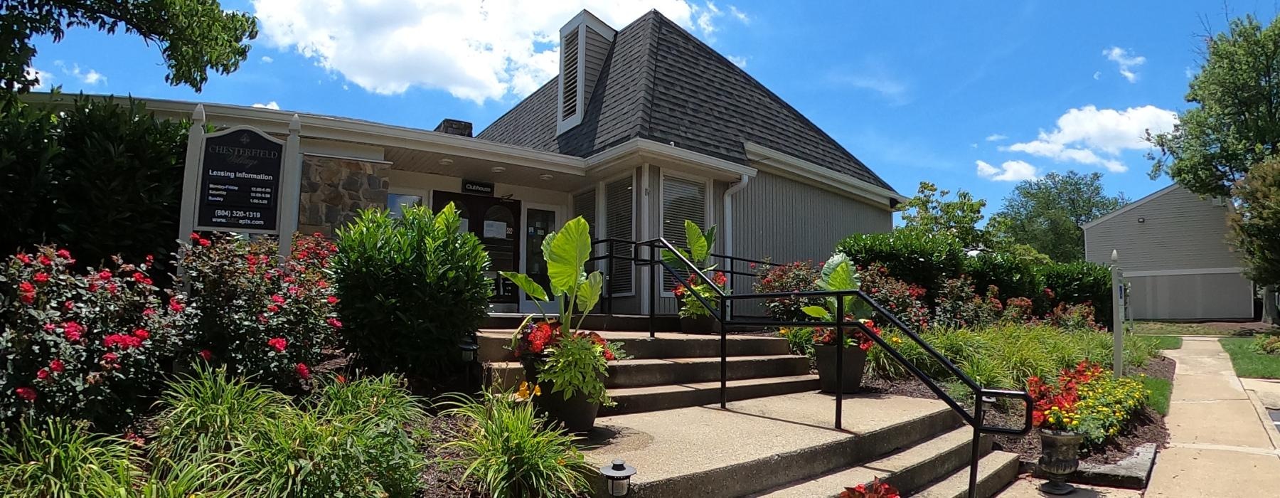 a building with a large yard of foilage