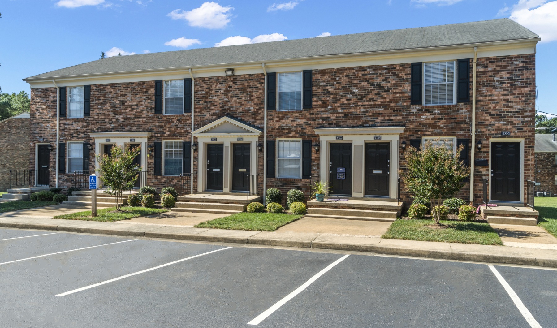 Exterior of Foxchase Brandywine Apartments featuring residential buildings and green space