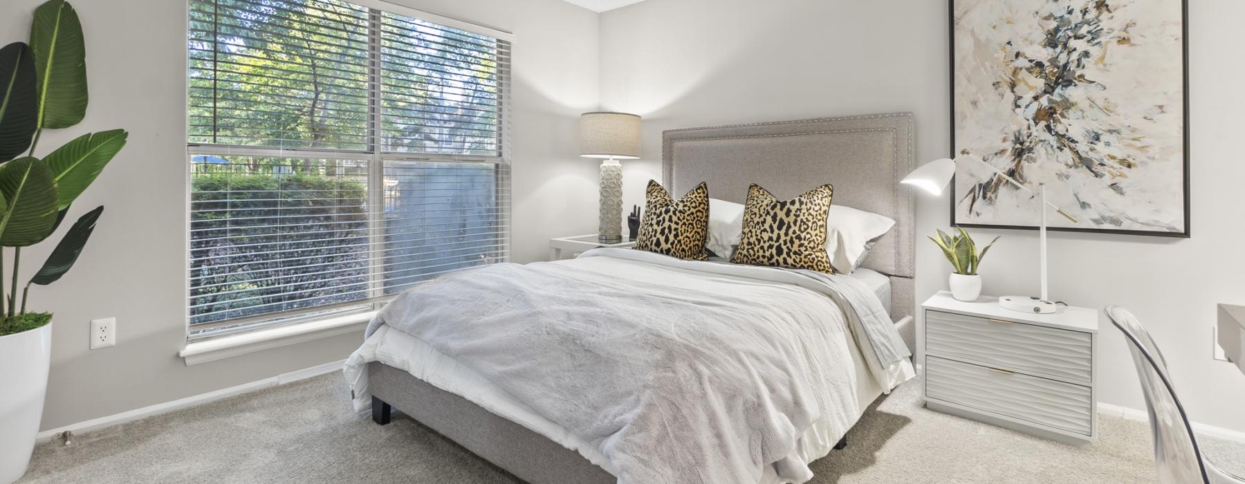 a bedroom with a large window