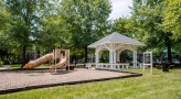 Playground with slides and climbing equipment and gazebo