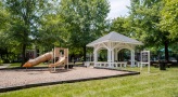 Playground with slides and climbing equipment and gazebo