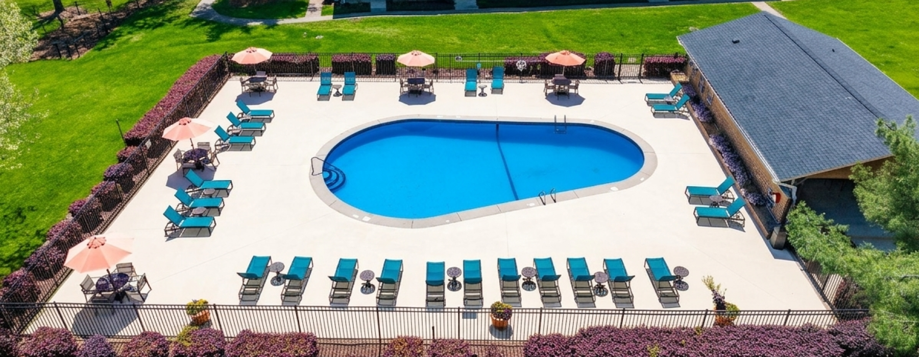 a swimming pool with a building in the background