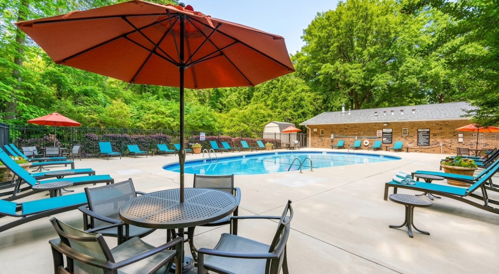 Swimming pool with lounge seating and umbrellas