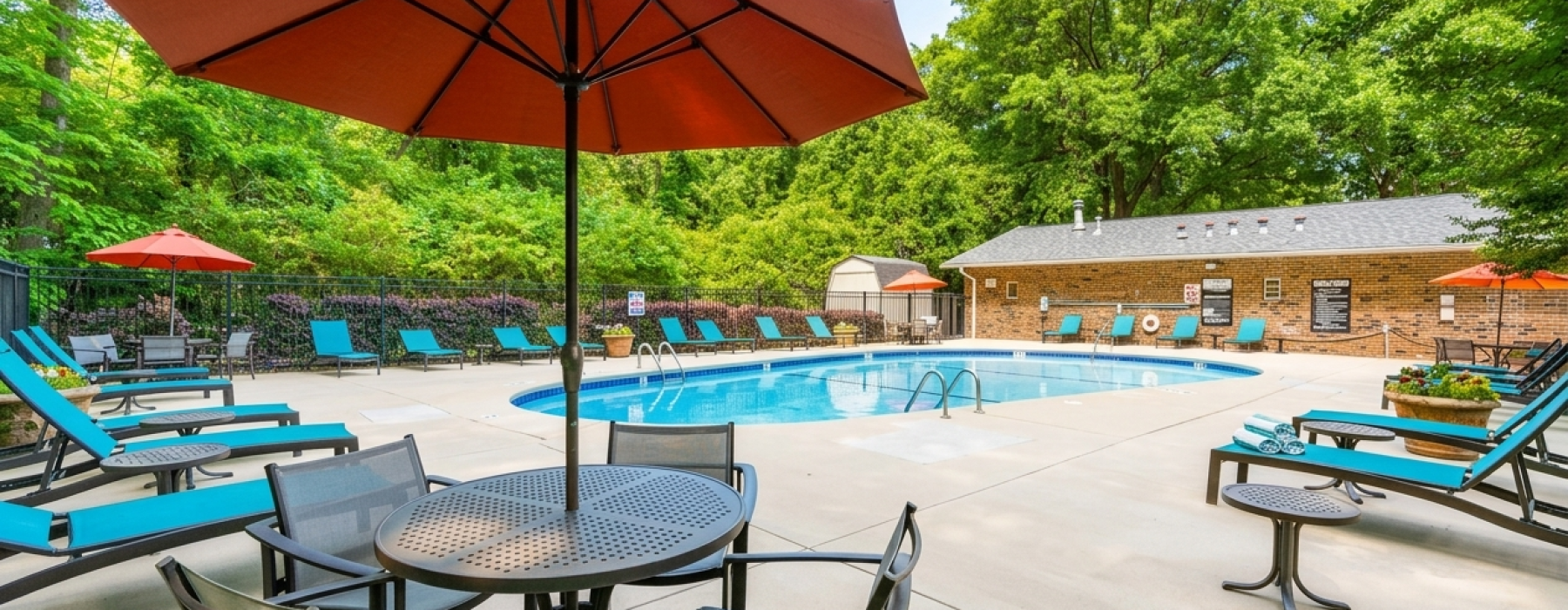 a pool with chairs and umbrellas