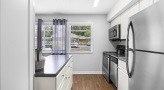 Kitchen with stainless steel appliances and built-in microwave
