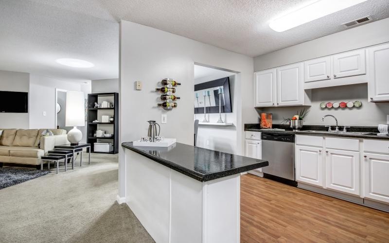 a kitchen with white cabinets