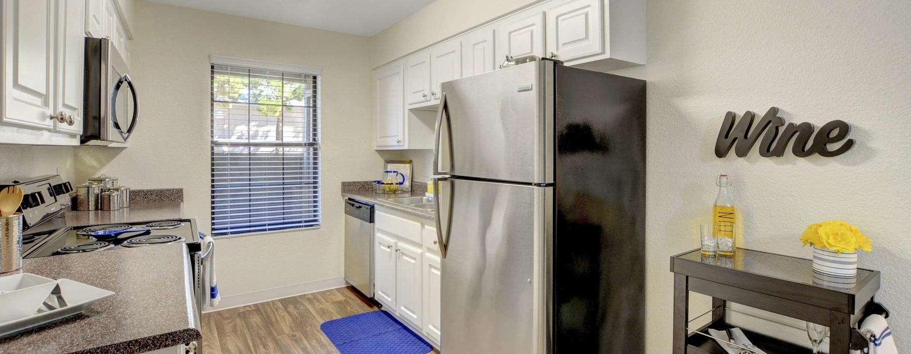 a kitchen with white cabinets
