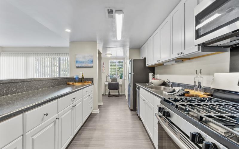 a kitchen with white cabinets
