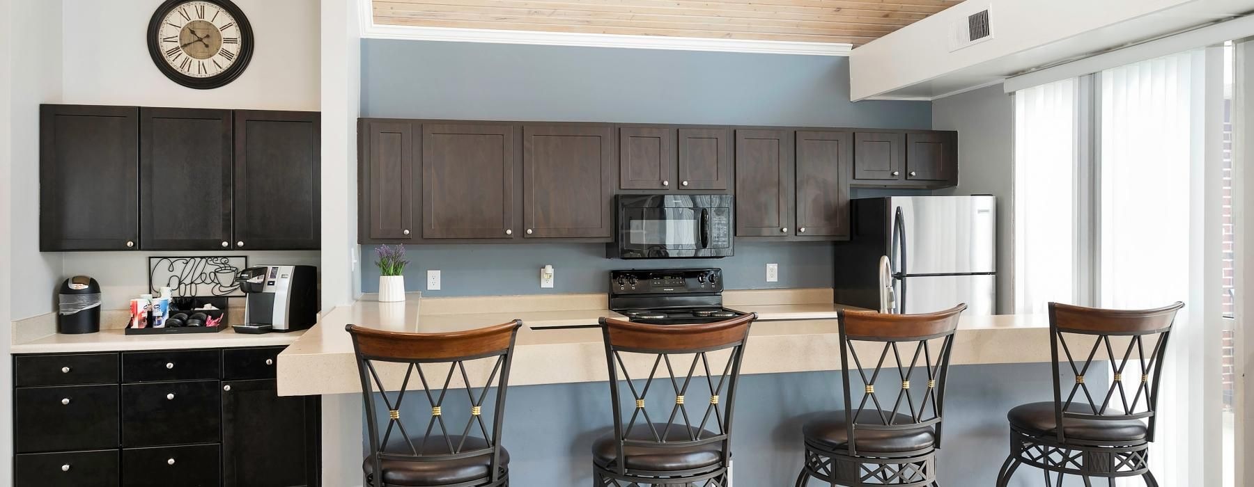 a kitchen with a table and chairs