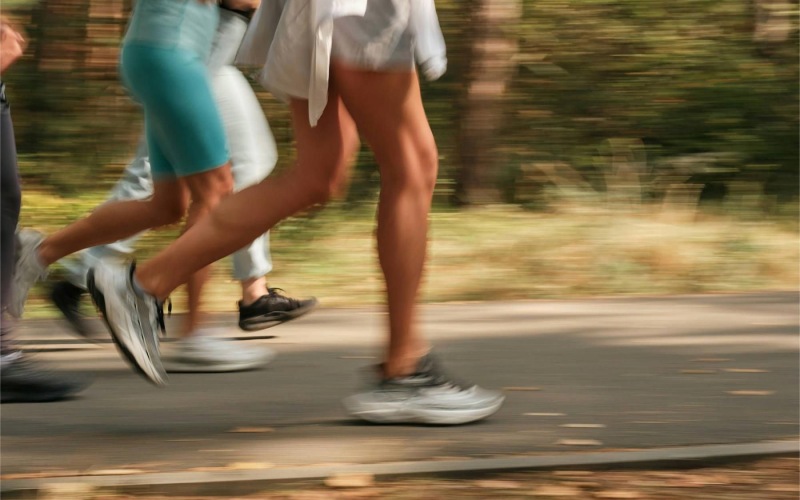 a group of people running on a road