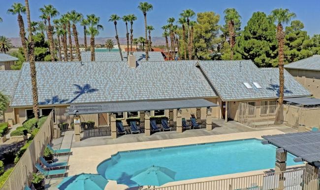 a swimming pool with a building in the background