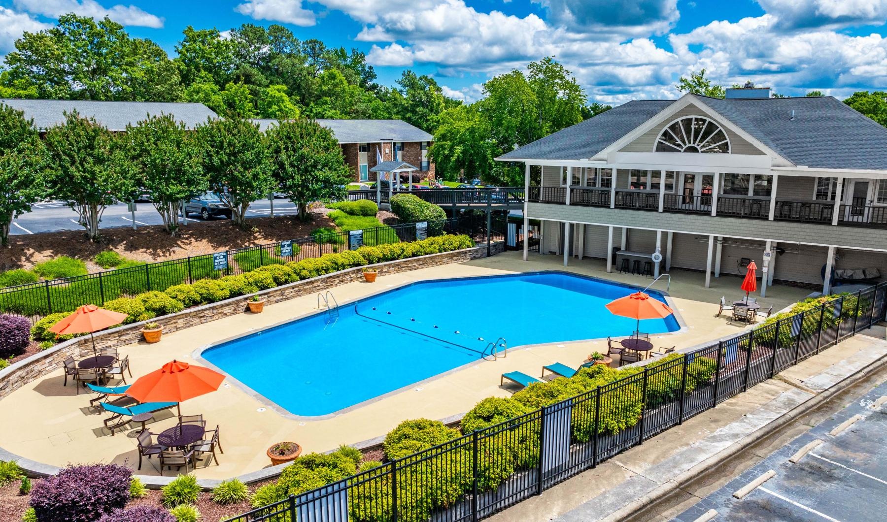 a swimming pool with umbrellas