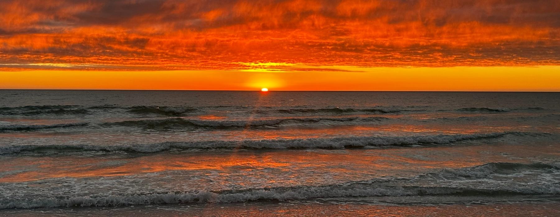 a sunset over the ocean