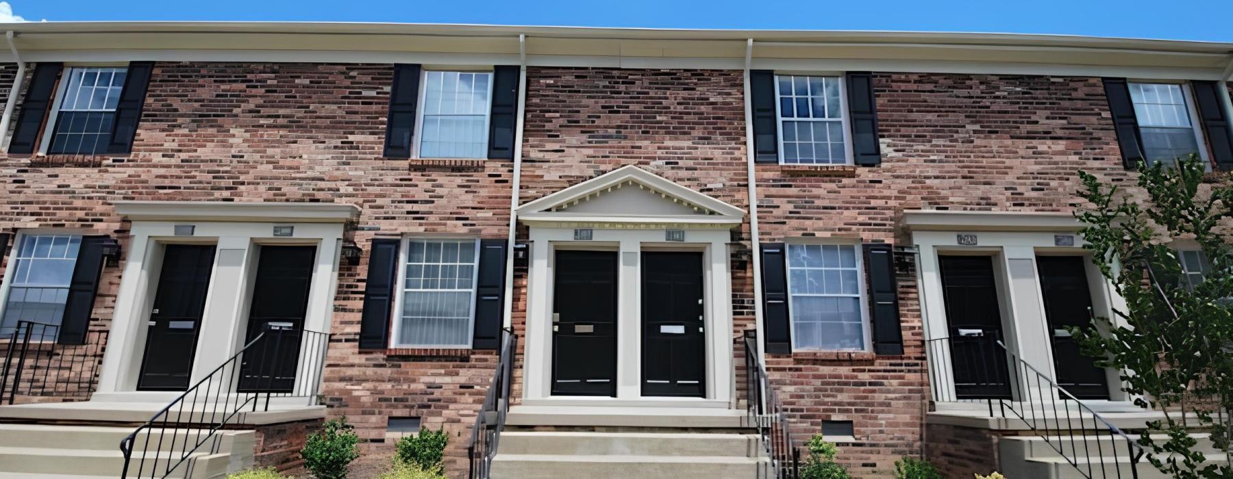 a brick building with a front entrance