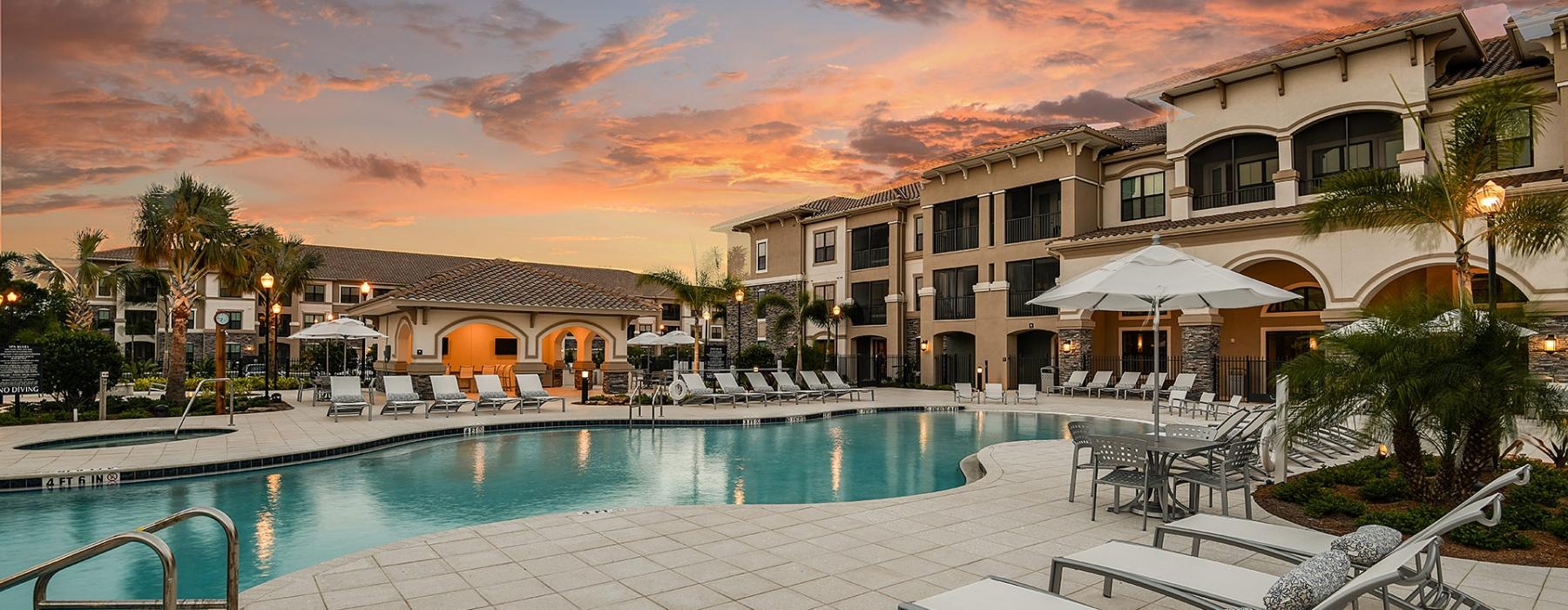 a pool with chairs around it