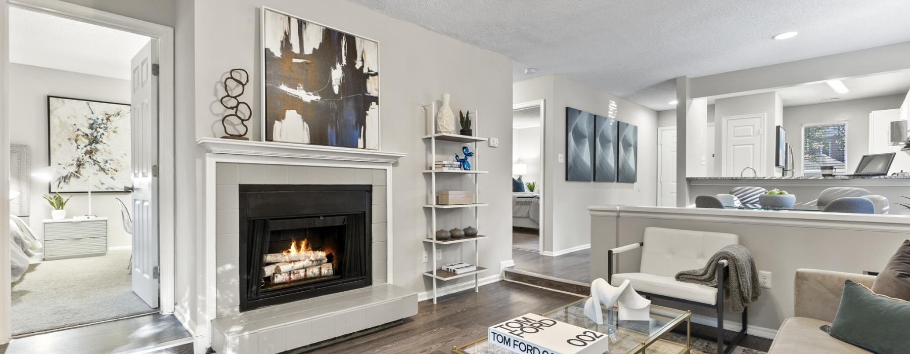a spacious room with a fireplace
