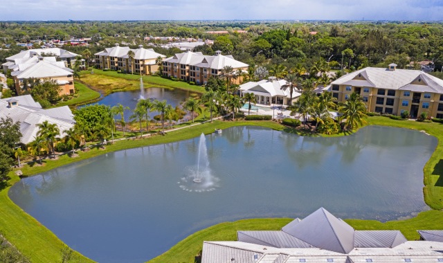 Charming Florida architecture is set in lush tropical landscaping surrounding two sparkling lakes