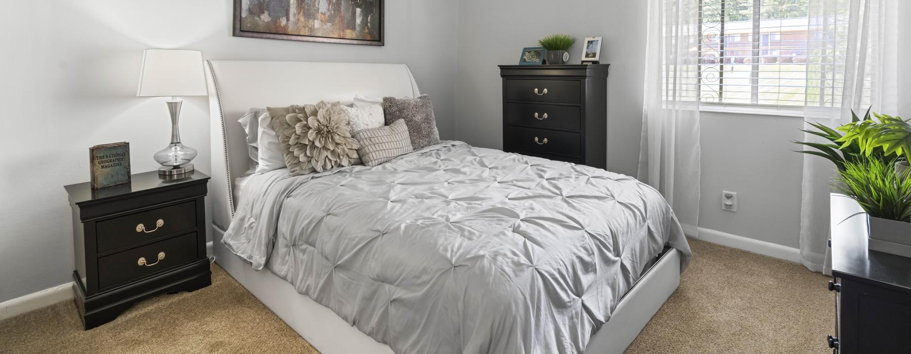 carpeted bedroom with window
