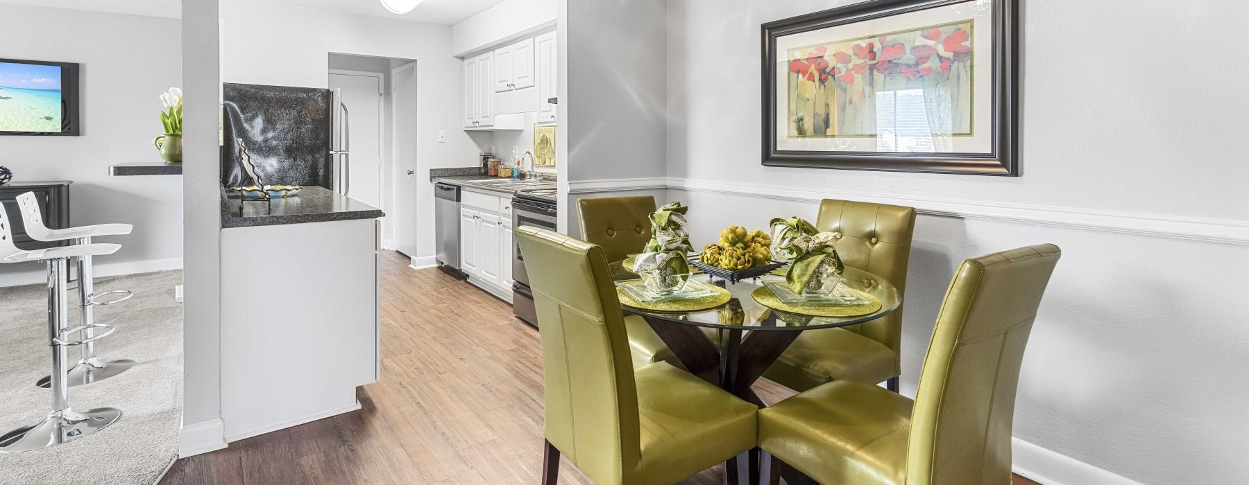 a dining room with a ceiling fan