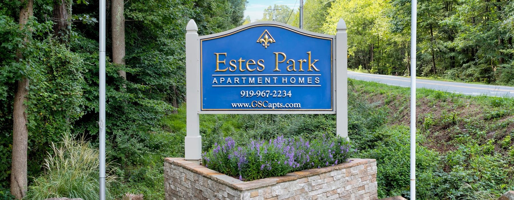 a sign on a stone wall