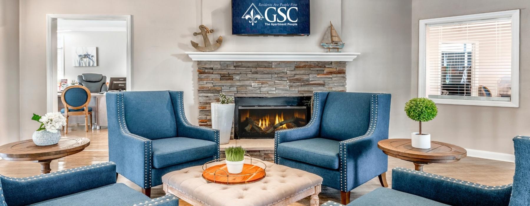 a lounge room with blue chairs