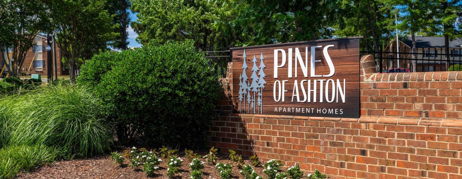 a sign on a brick wall