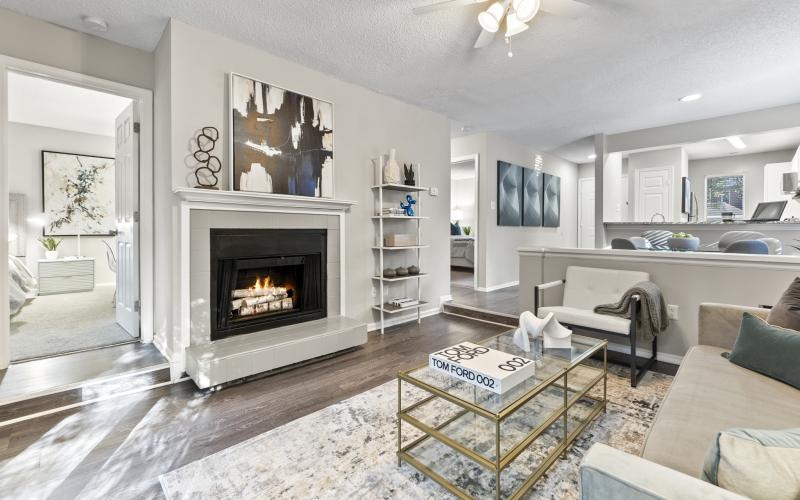 a spacious room with a fireplace