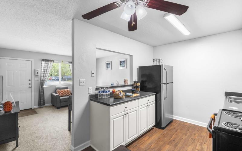a kitchen with a large fan