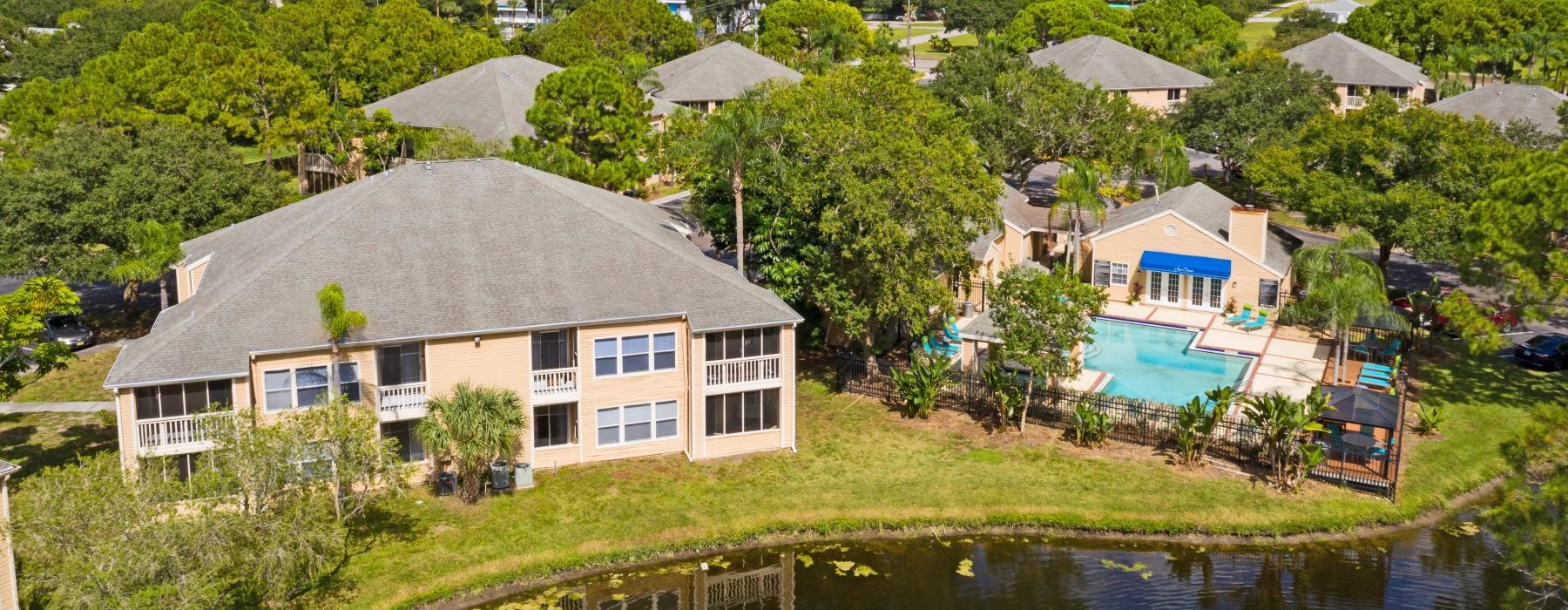a group of buildings next to a body of water