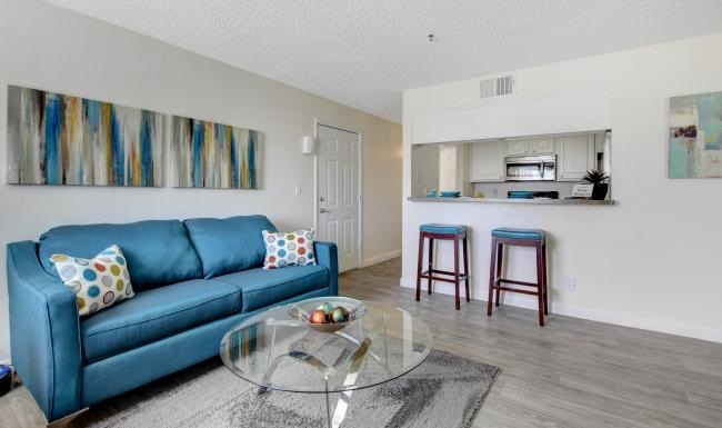 a living room with a blue couch