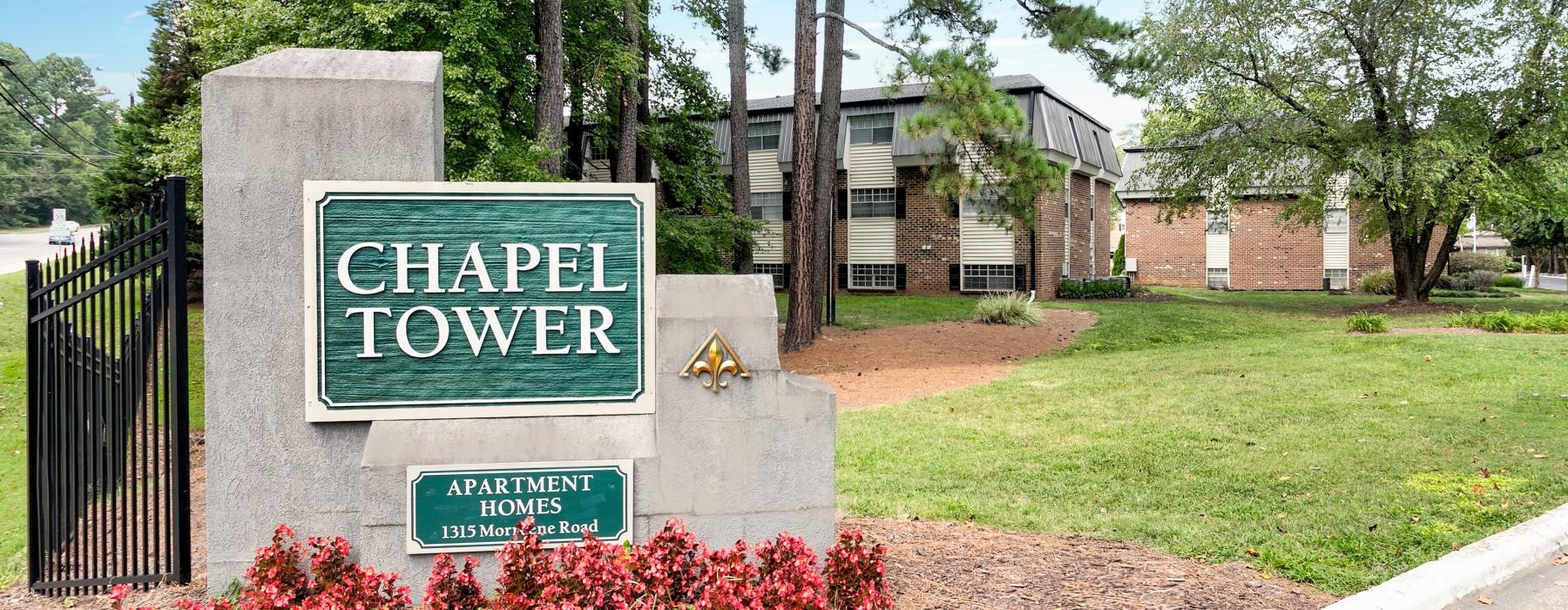 a sign in front of a building