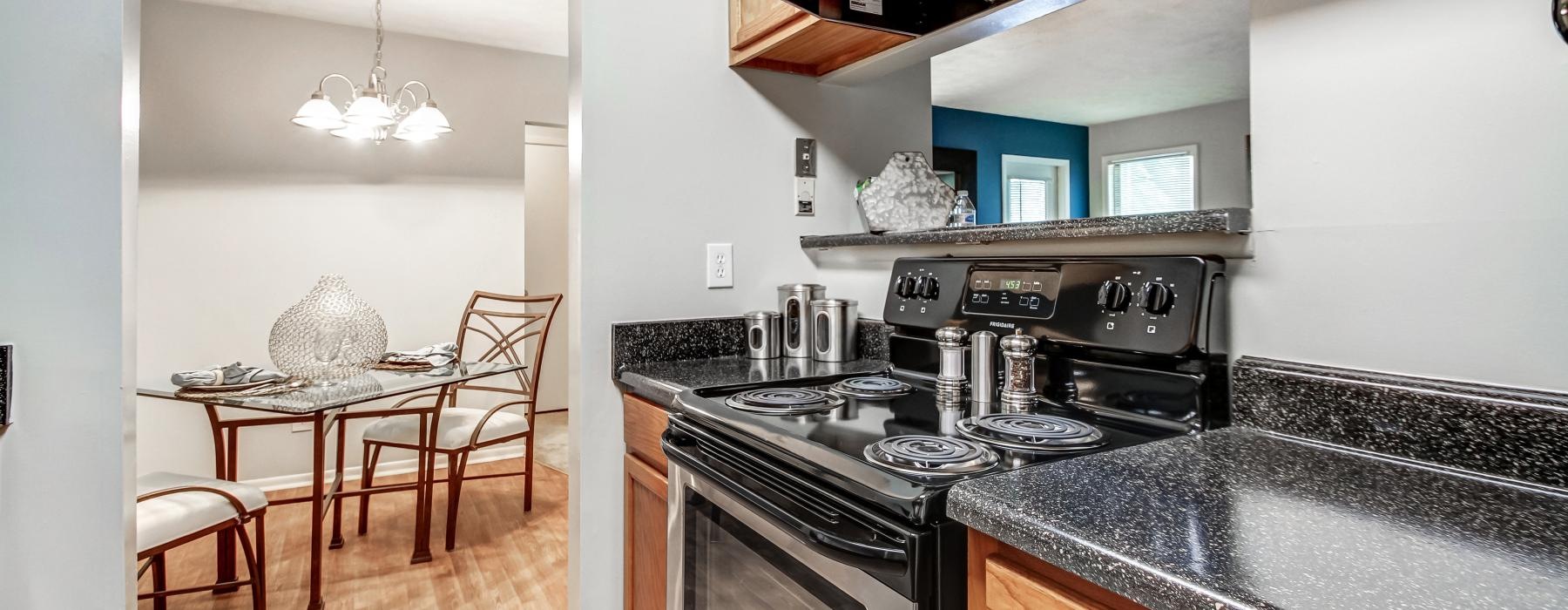 a kitchen with a stove and oven