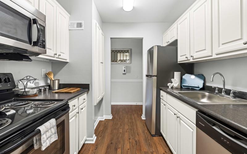 a kitchen with white cabinets
