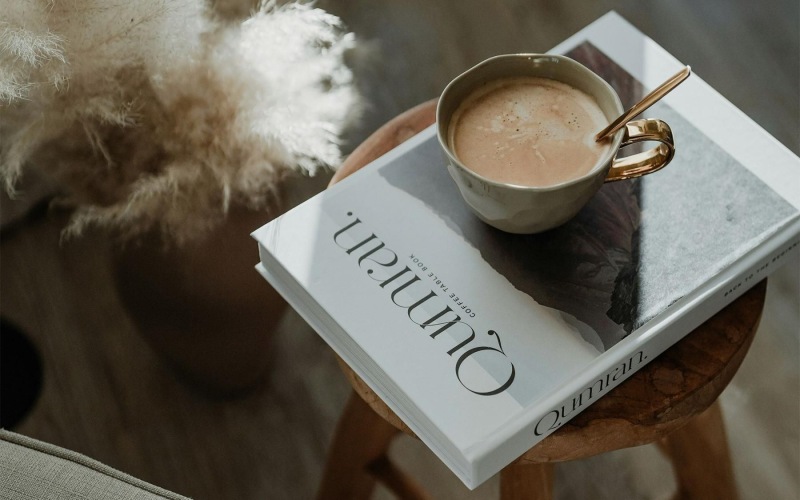a cup of coffee on a book