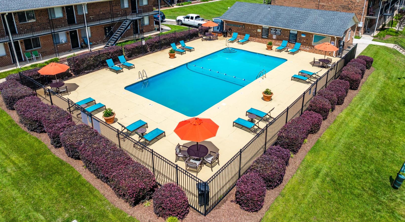 Sparkling pool surrounded by adjustable lounge chairs