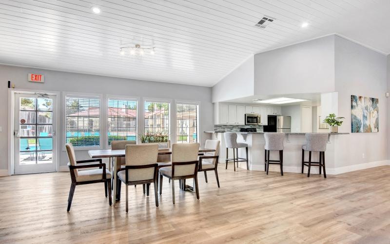 resident clubhouse with large windows and seating