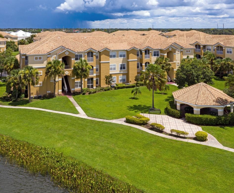 a building with a lawn and trees
