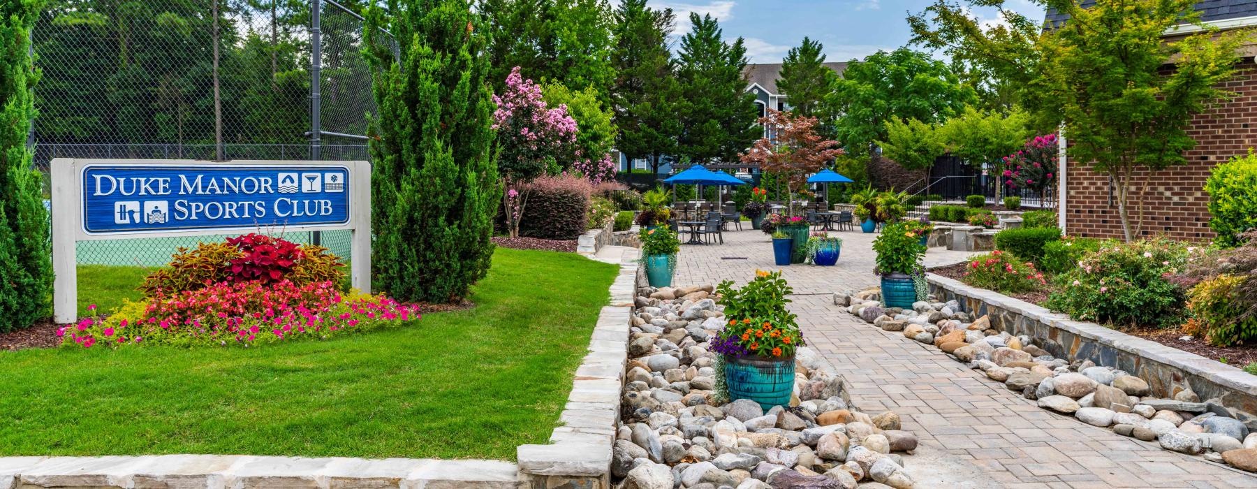a garden with a sign