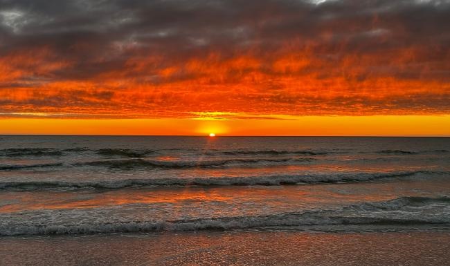 a sunset over the ocean