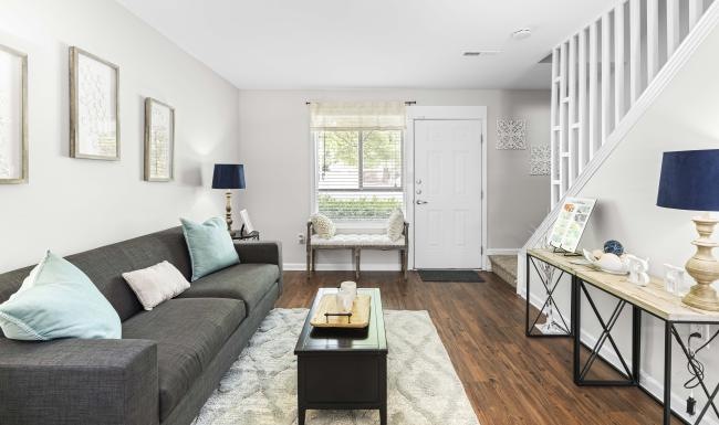a living room with a couch and a table